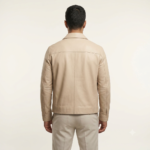 Side view of a man wearing a beige zip jacket with white t-shirt