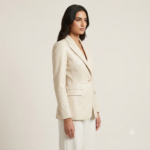 Side view of a woman wearing a cream tailored blazer with white wide-leg trousers