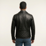Back view of a man wearing a black biker jacket with dark trousers