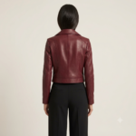 Back view of a woman wearing a burgundy biker jacket with black trousers